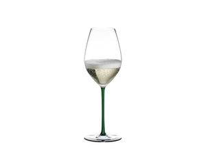 A RIEDEL Fatto A Mano Champagne Wine Glass in green filled with champagne on a transparent background. 