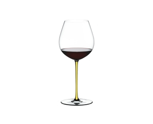 A RIEDEL Fatto A Mano Pinot Noir Yellow filled with red wine on a transparent background. 