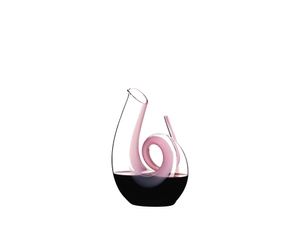 RIEDEL Curly Decanter - pink filled with a drink on a white background