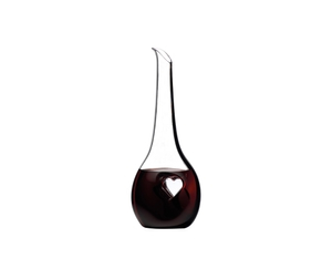 RIEDEL Black Tie Bliss Decanter filled with a drink on a white background