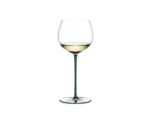 A RIEDEL Fatto A Mano Oaked Chardonnay glass in green filled with white wine on a transparent background. 