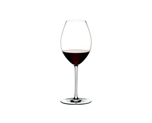 A RIEDEL Fatto A Mano Syrah glass in white filled with red wine on a transparent background. 