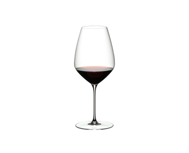 RIEDEL Veloce Syrah/Shiraz filled with a drink on a white background