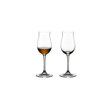 RIEDEL Vinum Cognac Hennessy filled with a drink on a white background