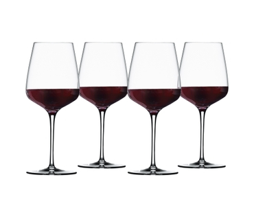 SPIEGELAU Willsberger Anniversary Bordeaux Glass filled with a drink on a white background