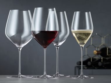 four wine glasses on table
