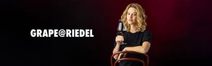 Woman holding GRAPE@RIEDEL glass