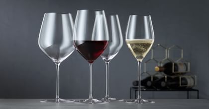four wine glasses on table
