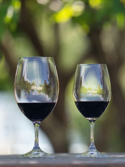 two red wine glasses outdoors