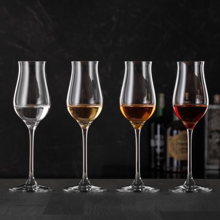 Four SPIEGELAU Digestive glasses, filled with different spirits.<br/>