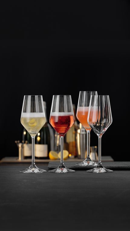 Four SPIEGELAU Lifestyle Champagne glasses filled with different Champagne