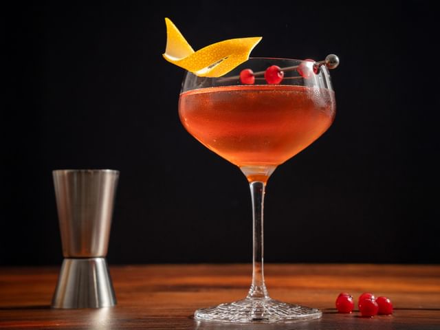 A cranberry Manhattan served in a SPIEGELAU Perfect Serve Collection Coupette Glass